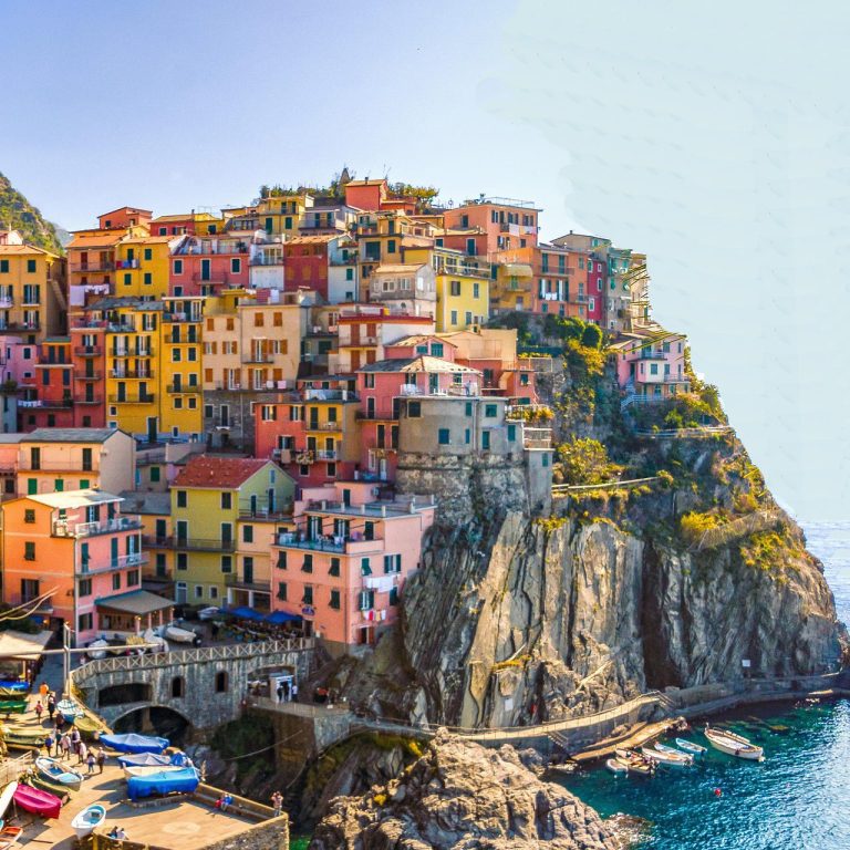 Discover breathtaking destinations around the world Colorful buildings overlooking a coastal village. Exotic Getaways & Cultural Adventures